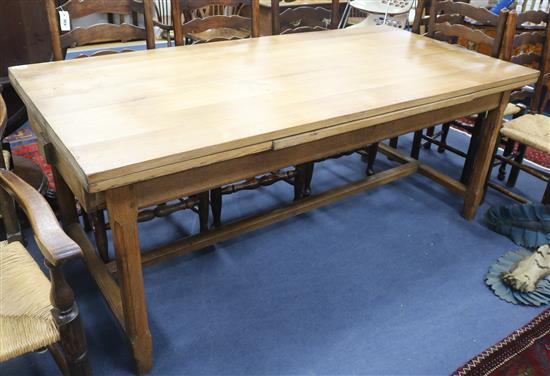 A 1920s oak draw leaf refectory table, 190 x 94cm